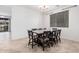 Bright dining room features tile flooring and a modern light fixture above the table at 3938 E Morrison Ranch Pkwy, Gilbert, AZ 85296