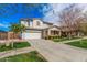 Inviting two-story home showcasing a manicured lawn and a spacious two-car garage at 3938 E Morrison Ranch Pkwy, Gilbert, AZ 85296