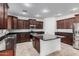 Modern kitchen featuring granite countertops, stainless steel appliances, and ample cabinet space at 3938 E Morrison Ranch Pkwy, Gilbert, AZ 85296