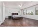 Spacious primary suite features wood floors, neutral paint, and lots of natural light at 3938 E Morrison Ranch Pkwy, Gilbert, AZ 85296