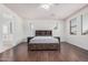 Spacious primary suite features wood floors, neutral paint, and lots of natural light at 3938 E Morrison Ranch Pkwy, Gilbert, AZ 85296