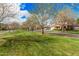 View down a tree-lined street in residential neighborhood with well-kept green spaces and sidewalks at 3938 E Morrison Ranch Pkwy, Gilbert, AZ 85296