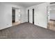 Comfortable bedroom with neutral carpet, closet, and access to an attached bathroom at 4237 E Clovis Ave, Mesa, AZ 85206