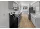 Efficient kitchen with stainless steel appliances, ample counter space, and modern cabinetry at 4237 E Clovis Ave, Mesa, AZ 85206