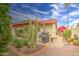 Desert landscaped backyard with barbecue grill, patio furniture, and mature cacti at 542 S Higley Rd # 102, Mesa, AZ 85206