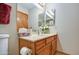 Bathroom featuring a single vanity with a marble countertop, decorative accessories, and neutral paint at 542 S Higley Rd # 102, Mesa, AZ 85206