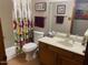 Bathroom featuring floral shower curtain, neutral paint, and warm toned tile at 542 S Higley Rd # 102, Mesa, AZ 85206