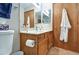 Bathroom featuring wood vanity, blue accented towels and neutral paint color at 542 S Higley Rd # 102, Mesa, AZ 85206