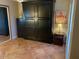 Bedroom featuring large wardrobe, neutral paint and warm toned tile at 542 S Higley Rd # 102, Mesa, AZ 85206