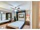 Bedroom featuring large wardrobe, neutral paint and warm toned tile at 542 S Higley Rd # 102, Mesa, AZ 85206