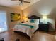 Comfortable bedroom featuring a queen bed and soft lighting creating a relaxing ambiance at 542 S Higley Rd # 102, Mesa, AZ 85206