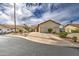 Inviting single-story home with a red tile roof, a two-car garage, and well-maintained landscaping at 542 S Higley Rd # 102, Mesa, AZ 85206