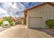Single-story home with attached two-car garage, desert landscaping, and a vibrant red tile roof at 542 S Higley Rd # 102, Mesa, AZ 85206