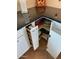 Kitchen with granite countertops and white cabinetry featuring convenient corner storage solutions and roll out shelves at 542 S Higley Rd # 102, Mesa, AZ 85206