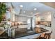 Bright kitchen features black granite countertops, white cabinets, and recessed lighting at 542 S Higley Rd # 102, Mesa, AZ 85206