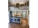 Bright kitchen features tile flooring, modern cabinetry, breakfast bar with seating, and neutral decor at 542 S Higley Rd # 102, Mesa, AZ 85206