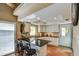 Bright kitchen with white cabinets, granite countertops, and barstool seating at the island at 542 S Higley Rd # 102, Mesa, AZ 85206