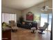 Cozy living room featuring comfortable seating, neutral decor, and ample natural light at 542 S Higley Rd # 102, Mesa, AZ 85206