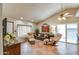 A cozy living room with tile floors, comfortable seating, and plenty of natural light at 542 S Higley Rd # 102, Mesa, AZ 85206