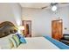 Well-lit main bedroom with ensuite bathroom, ceiling fan, and neutral colors with tasteful decor at 542 S Higley Rd # 102, Mesa, AZ 85206