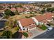 Aerial view of neighborhood homes featuring red tile roofs and well-maintained landscaping at 5778 W Corrine Dr, Glendale, AZ 85304