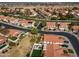 A serene aerial view shows well-maintained homes with manicured lawns in a quiet, friendly neighborhood at 5778 W Corrine Dr, Glendale, AZ 85304