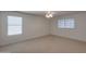 Large bedroom with dual windows and ceiling fan at 5778 W Corrine Dr, Glendale, AZ 85304