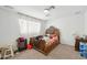 Bedroom features carpet, a large bed and a large sunny window making for a cozy and bright atmosphere at 6541 N 41St Ave, Phoenix, AZ 85019