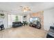 Bright living room with stone accent wall, modern furnishings, and lots of natural light at 6541 N 41St Ave, Phoenix, AZ 85019