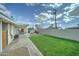 Expansive backyard featuring a lush lawn, covered patio, and well-maintained landscaping at 6851 E Windsor Ave, Scottsdale, AZ 85257