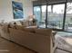 The comfortable living room features a door out to the private balcony at 7120 E Kierland Blvd # 211, Scottsdale, AZ 85254