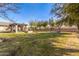Sprawling backyard with a covered outdoor living space, built-in fireplace, and sunken trampoline, great for entertainment and relaxation at 7215 W Union Hills Dr, Glendale, AZ 85308