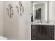 Modern bathroom featuring a sleek vanity with a lighted mirror and stylish decor at 7215 W Union Hills Dr, Glendale, AZ 85308