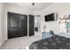 Bedroom features ample storage, a mounted TV, and is conveniently located next to an ensuite bathroom at 7215 W Union Hills Dr, Glendale, AZ 85308