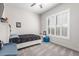 Bright bedroom offers carpet flooring, window with shutters, and ceiling fan, for comfort and a pleasant ambiance at 7215 W Union Hills Dr, Glendale, AZ 85308