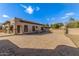 Expansive brick-paved driveway and desert landscaping enhance the home's exterior appeal at 7215 W Union Hills Dr, Glendale, AZ 85308