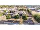 Charming home boasts a well-manicured front yard, mature shade trees, and a spacious driveway leading to a three-car garage at 7215 W Union Hills Dr, Glendale, AZ 85308