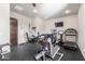Home gym featuring various equipment and a wall-mounted television at 7215 W Union Hills Dr, Glendale, AZ 85308