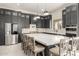 Spacious kitchen with stainless steel appliances, a large island, and dark wood cabinetry at 7215 W Union Hills Dr, Glendale, AZ 85308