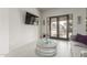 Bright living area with French doors, tile flooring, and modern decor at 7215 W Union Hills Dr, Glendale, AZ 85308