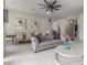 Bright, open-concept living and dining area with tile floors and stylish decor at 7215 W Union Hills Dr, Glendale, AZ 85308
