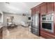Spacious open floorplan combining kitchen, dining area, and living room with cohesive design elements at 7215 W Union Hills Dr, Glendale, AZ 85308