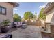 Cozy patio with stone pavers, fountain, and elegant seating area with gate at 7215 W Union Hills Dr, Glendale, AZ 85308