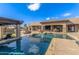 Inviting pool area with pergola, lounge chairs, and well-manicured landscaping, creating a serene outdoor oasis at 7215 W Union Hills Dr, Glendale, AZ 85308