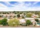 Aerial view of a golf community featuring well maintained houses and golf course views at 7818 E Cactus Wren Rd, Scottsdale, AZ 85250