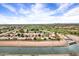 Aerial view featuring community near golf course and waterway at 7818 E Cactus Wren Rd, Scottsdale, AZ 85250