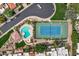 Aerial view of community pool, tennis courts and clubhouse, with lush landscaping and neighborhood surroundings at 7818 E Cactus Wren Rd, Scottsdale, AZ 85250