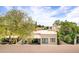 Private backyard with covered patio and desert landscaping at 7818 E Cactus Wren Rd, Scottsdale, AZ 85250