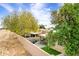 Private backyard featuring a covered patio, stone pavers, and desert landscaping at 7818 E Cactus Wren Rd, Scottsdale, AZ 85250