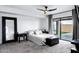 Clean, spacious bedroom featuring plush carpeting, large window, and a modern ceiling fan at 7818 E Cactus Wren Rd, Scottsdale, AZ 85250